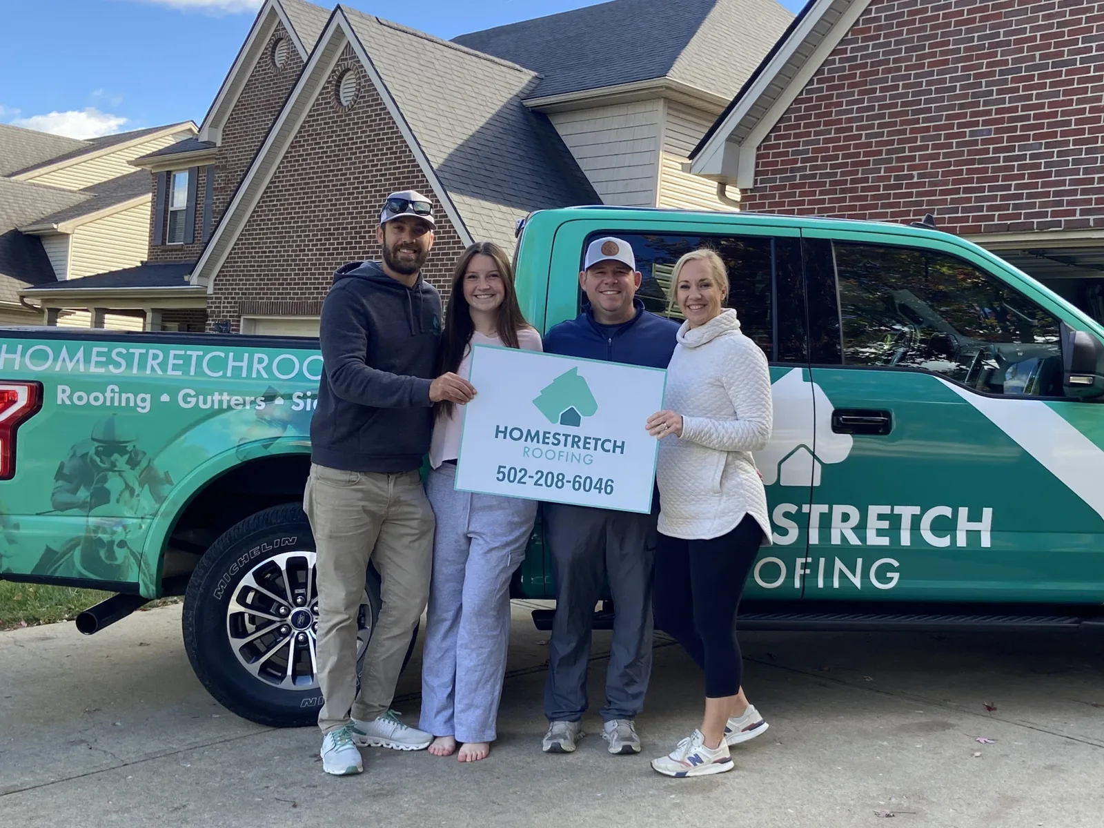 Homestretch Roofing team and branded truck on a Louisville job site