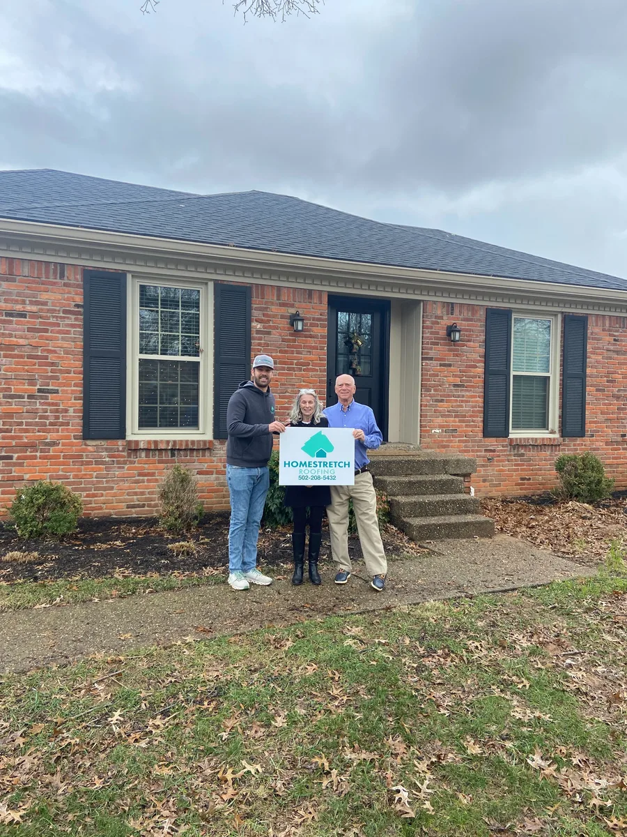 Homestretch Roofing team after a successful roof replacement