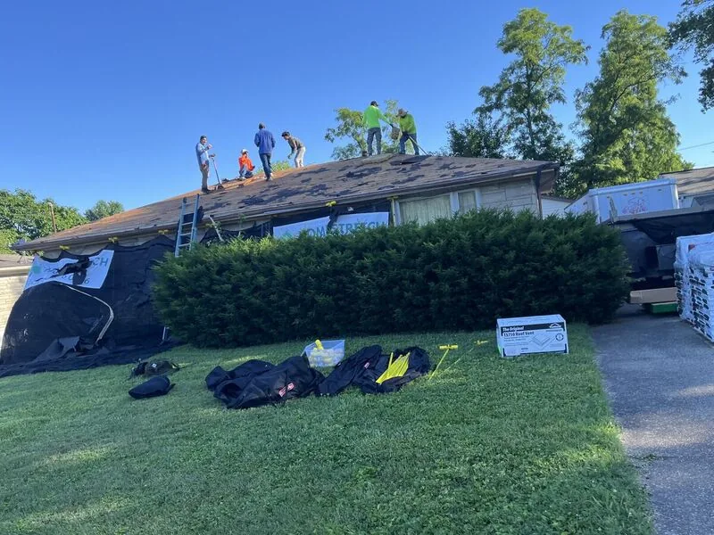 Homestretch Roofing crew tearing off and replacing a roof in Louisville, KY