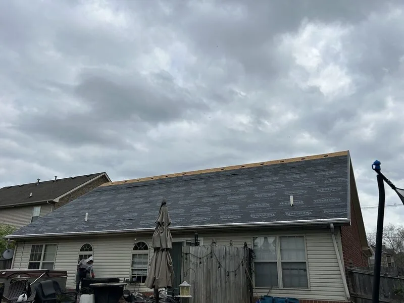 Homestretch Roofing crew installing shingles
